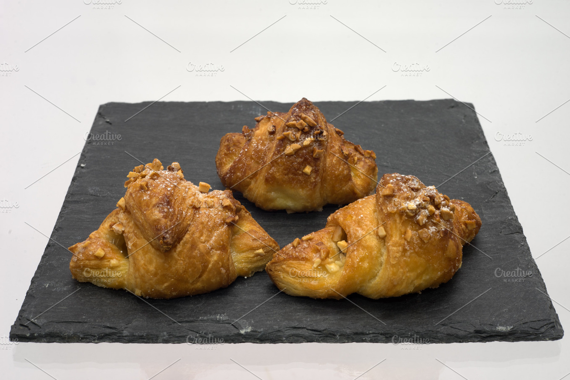 3 croissants over an slate plate, a Food & Drink Photo by davidalca