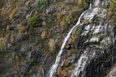 Waterfall in the mountain, a Background Photo by Simmi Simons