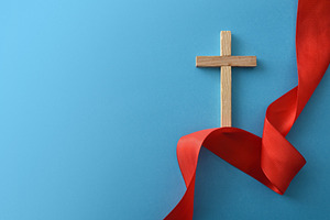 Wooden Cross with Red Ribbon on Blue Background, a Holiday Photo by Davizro's Market