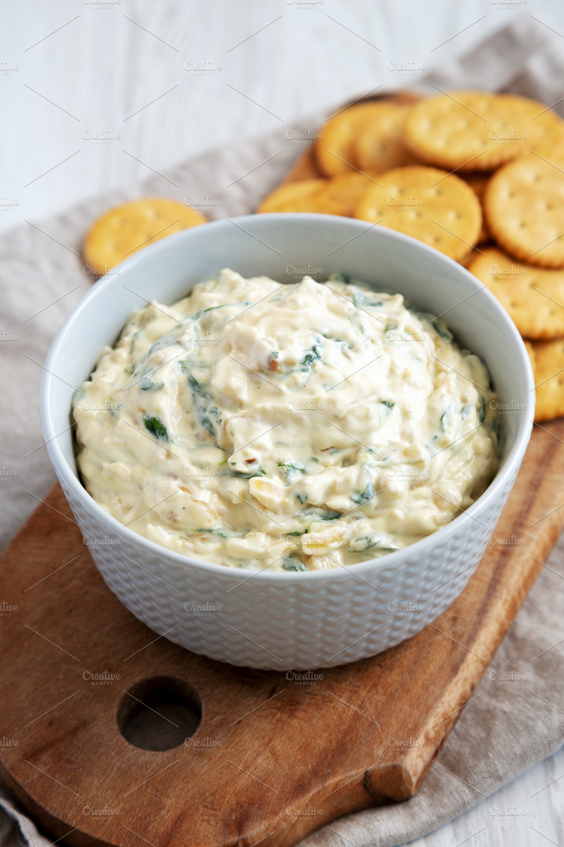 Homemade Caramelized Onion and Spinach Dip with Salty Round Crac, a Food & Drink Photo by LiudmylaChuhunova
