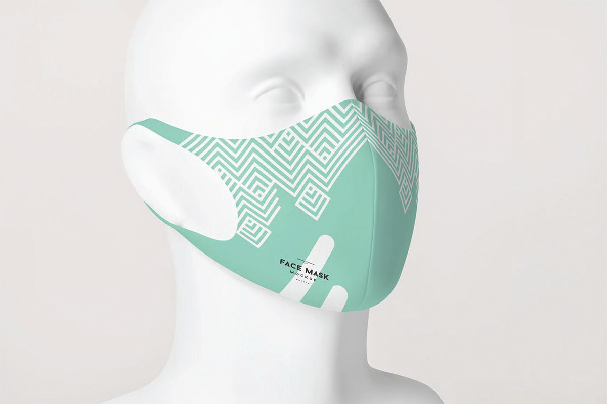 Teal Fabric Face Mask Model Mockup, a Mask Mockup by DesignRushMarket (Photo 1 of 2)