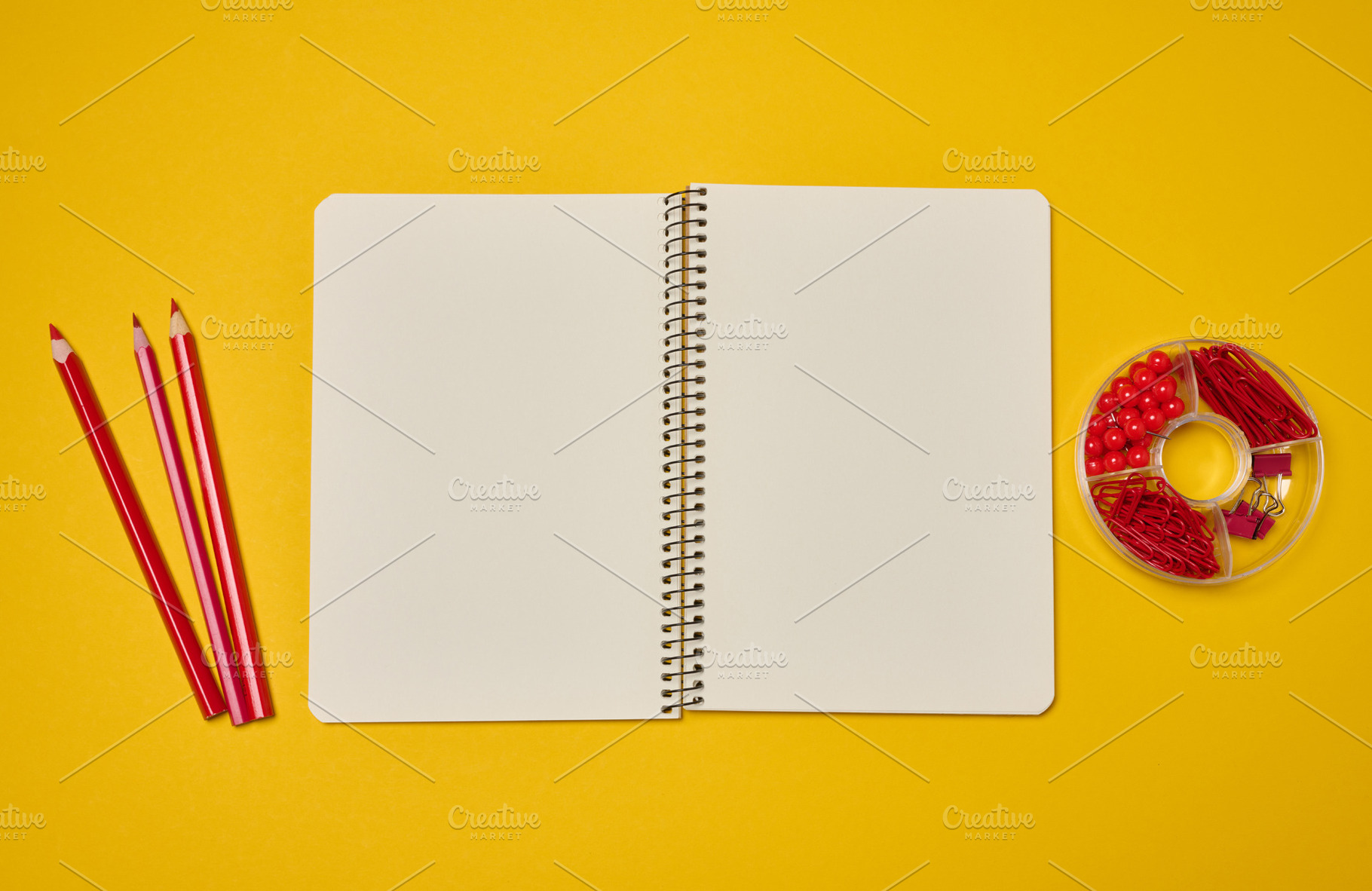 An open spiral-bound notebook with blank pages, surrounded by re, a School & Education Photo by ndanko