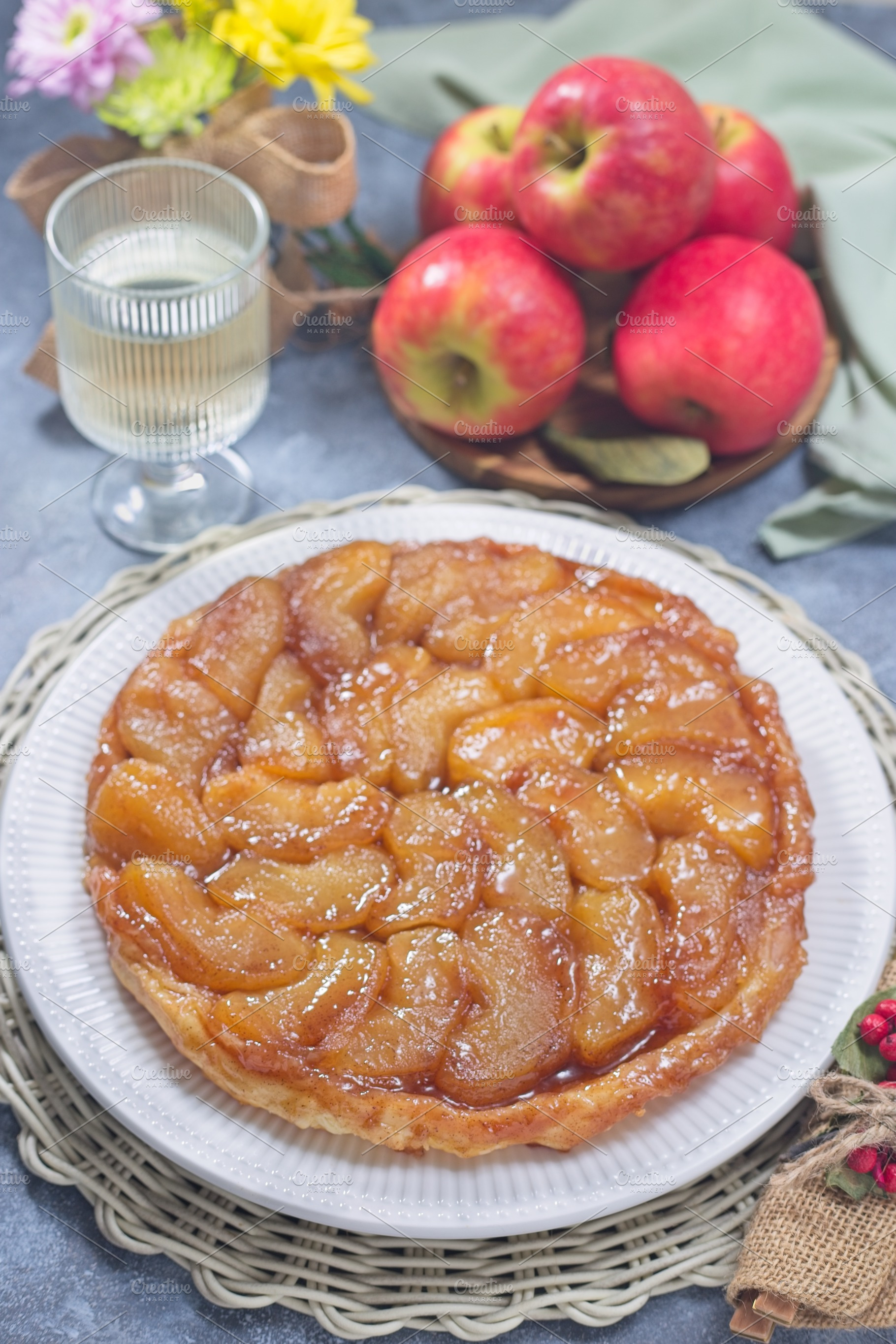Caramelized apple Tart Tartin on plate, french upside down cake, vertical, a Food & Drink Photo by iuliia_n