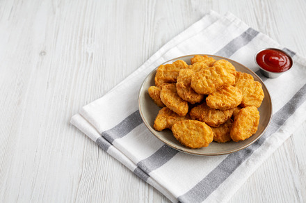 Homemade Chicken Nuggets with Ketchup, side view., a Food & Drink Photo by LiudmylaChuhunova