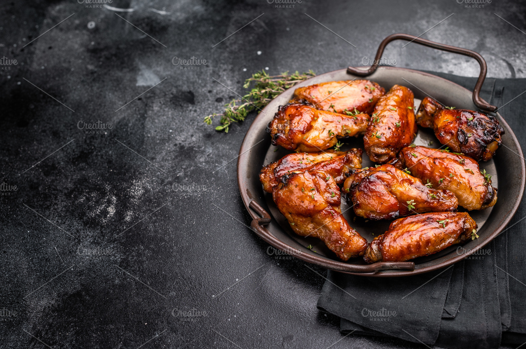 Savory grilled chicken wings smothered in tangy barbecue sauce,, a Food & Drink Photo by composter-box@mail.ru