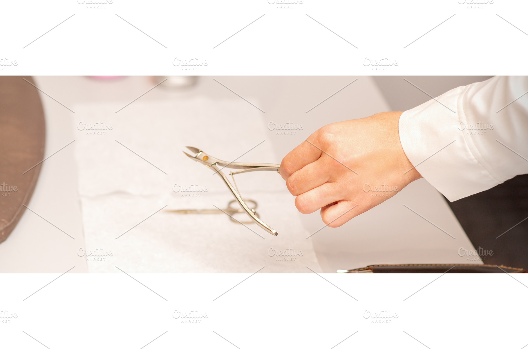 Nail nippers in the hand of female, a Beauty & Fashion Photo by okskukuruza