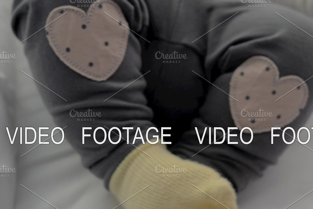 Active baby girl in yellow socks and, a Graphic by Grey Coast Media (Photo 1 of 2)