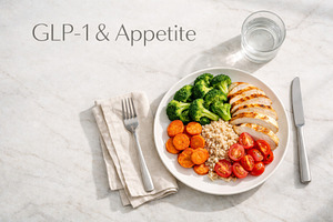 Plate with grilled chicken, vegetables, and quinoa on marble sur, a Photo by Dvoevnore photos
