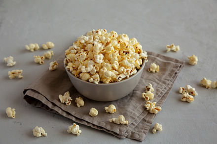 Homemade Salty Popcorn in a Bowl, side view., a Food & Drink Photo by LiudmylaChuhunova