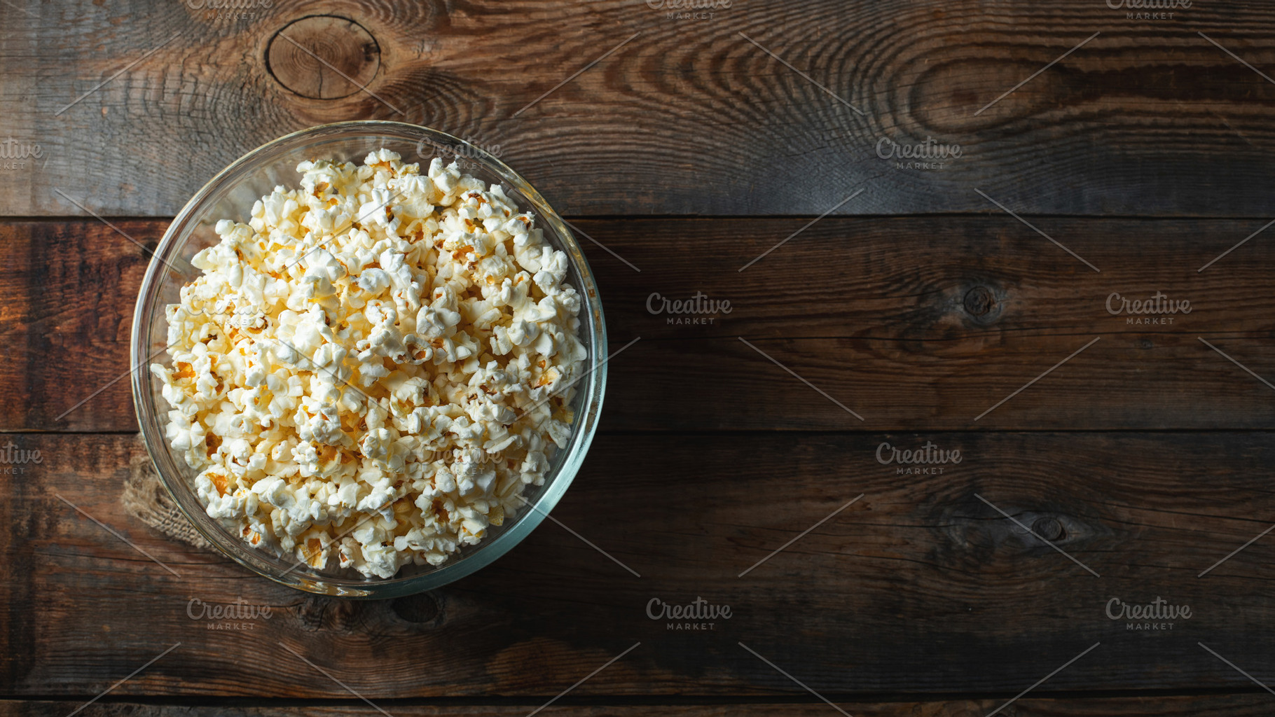 Popcorn on wood color background.Food and snack concepts ideas.Minimal style to, a Food & Drink Photo by Budarinphoto