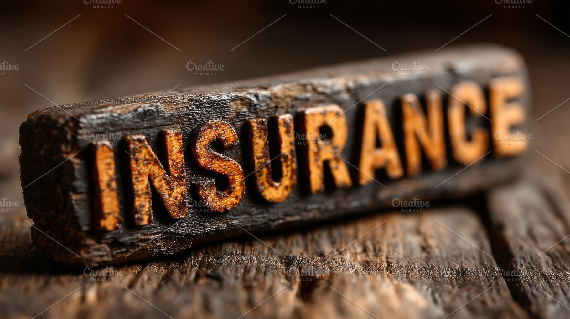 Rustic wooden block with the word insurance engraved and highlighted in orange, a Photo by AS photostudio