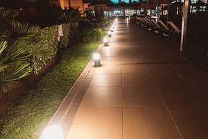Resort walkway with night lights, an Architecture Photo by SkyNext