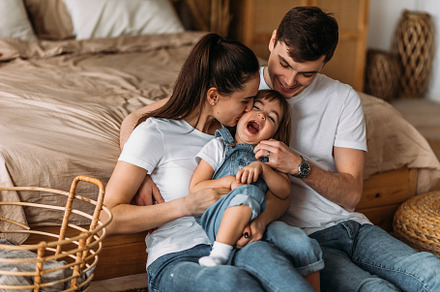 Portrait of a happy young family, a Person Photo by SOTNIKOV_MISHA