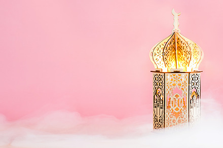 Ornamental wooden Ramadan Kareem lantern lamp on pink background with smoke. Mu, a Holiday Photo by photoguns