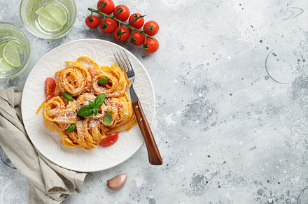 Tasty appetizing classic italian tagliatelle pasta with tomato sauce, cheese pa, a Food & Drink Photo by Budarinphoto
