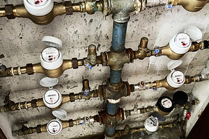 Water meter system in residential building in Lisbon, Portugal, detailed view, a Photo by AS photostudio
