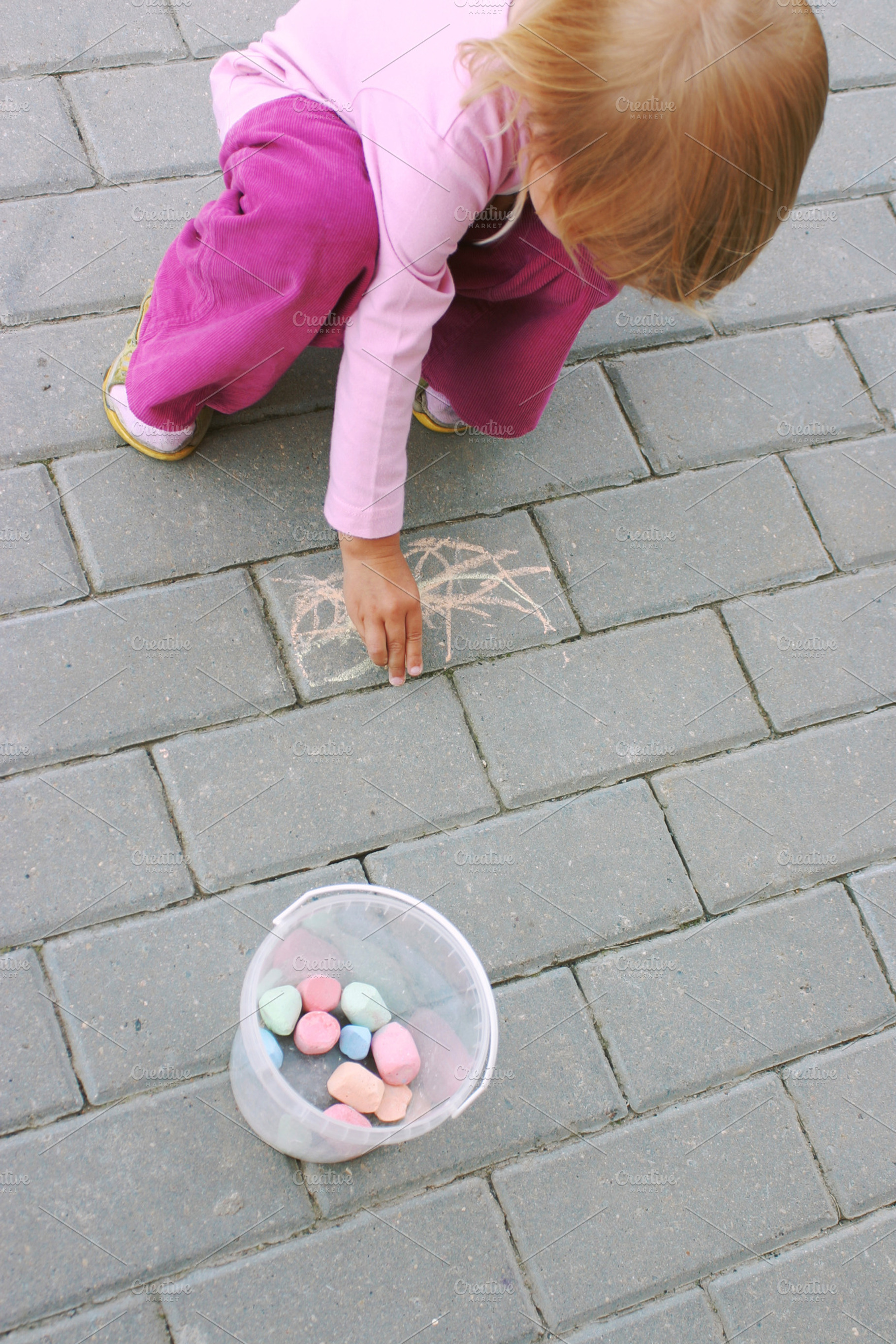 Little girl drawing with crayon, a Person Photo by BOOCYS