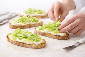 Slices of bread with ricotta and asp, a Photo by Dvoevnore photos