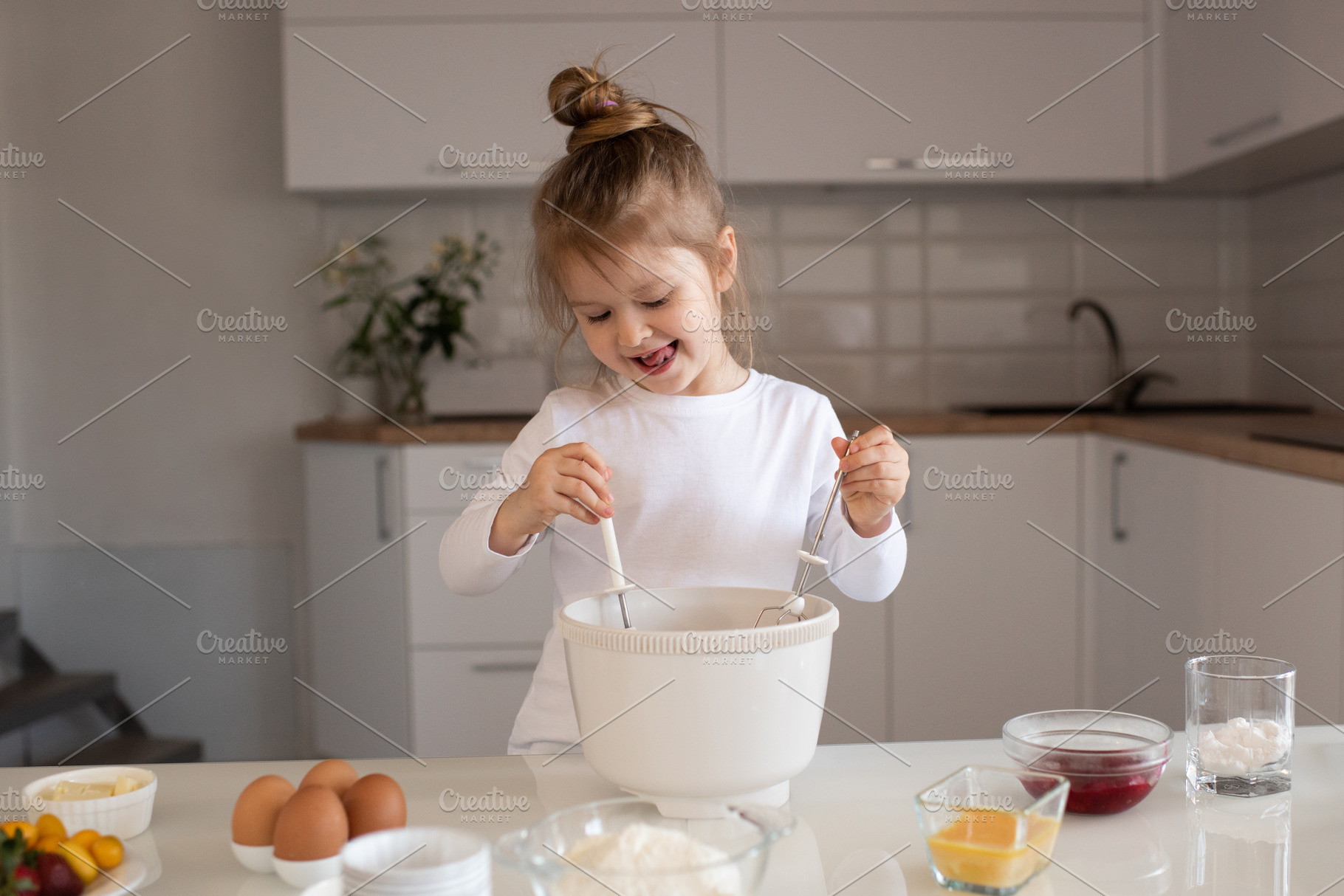 Child girl making cake, a Person Photo by morrowlight