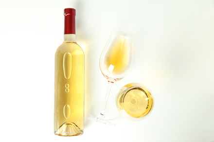 Bottle and glasses of wine on white background, a Food & Drink Photo by AtlasStudio PRO