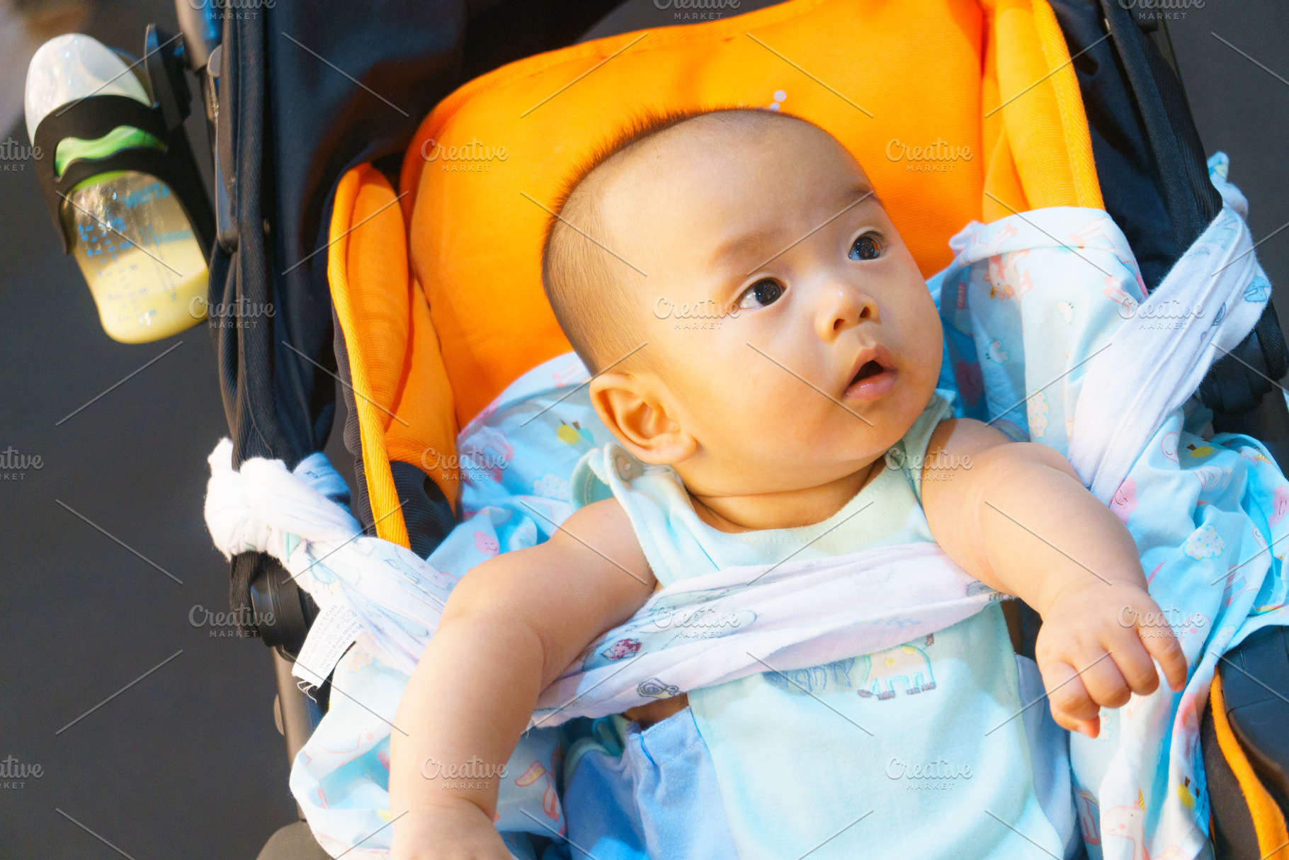 curious baby in stroller, exploring world around them, a Person Photo by a454