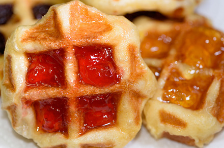 Close up fresh waffles with above strawberry jam