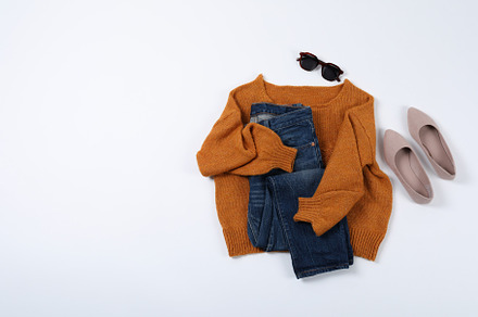 Autumn style clothes on white background, top view, a Beauty & Fashion Photo by AtlasStudio
