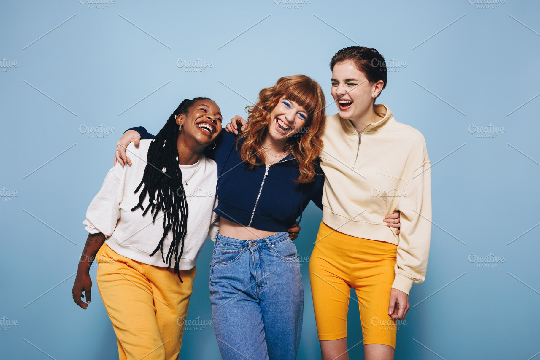 Diverse female friends laughing and having a good time while emb, a Person Photo by Jacob Lund