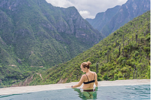 Female tourist exploring Grutas, a Nature Photo by Elizaveta Galitskaya