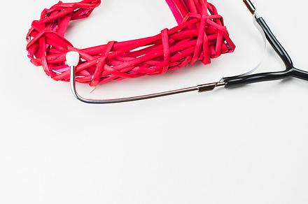 Closeup of creative composition made with big mockup heart and stethoscope on, a Health & Medical Photo by José Luis Agudo