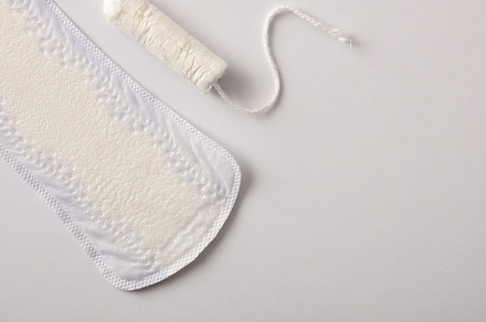 Background with female protectors for menstrual cycle on white b, a Health & Medical Photo by Davizro's Market