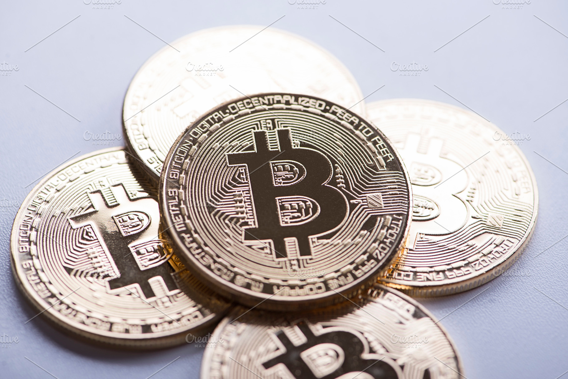 Several bitcoin coins on white background cryptocurrency containing bitcoin, a Business Photo by José Luis Agudo