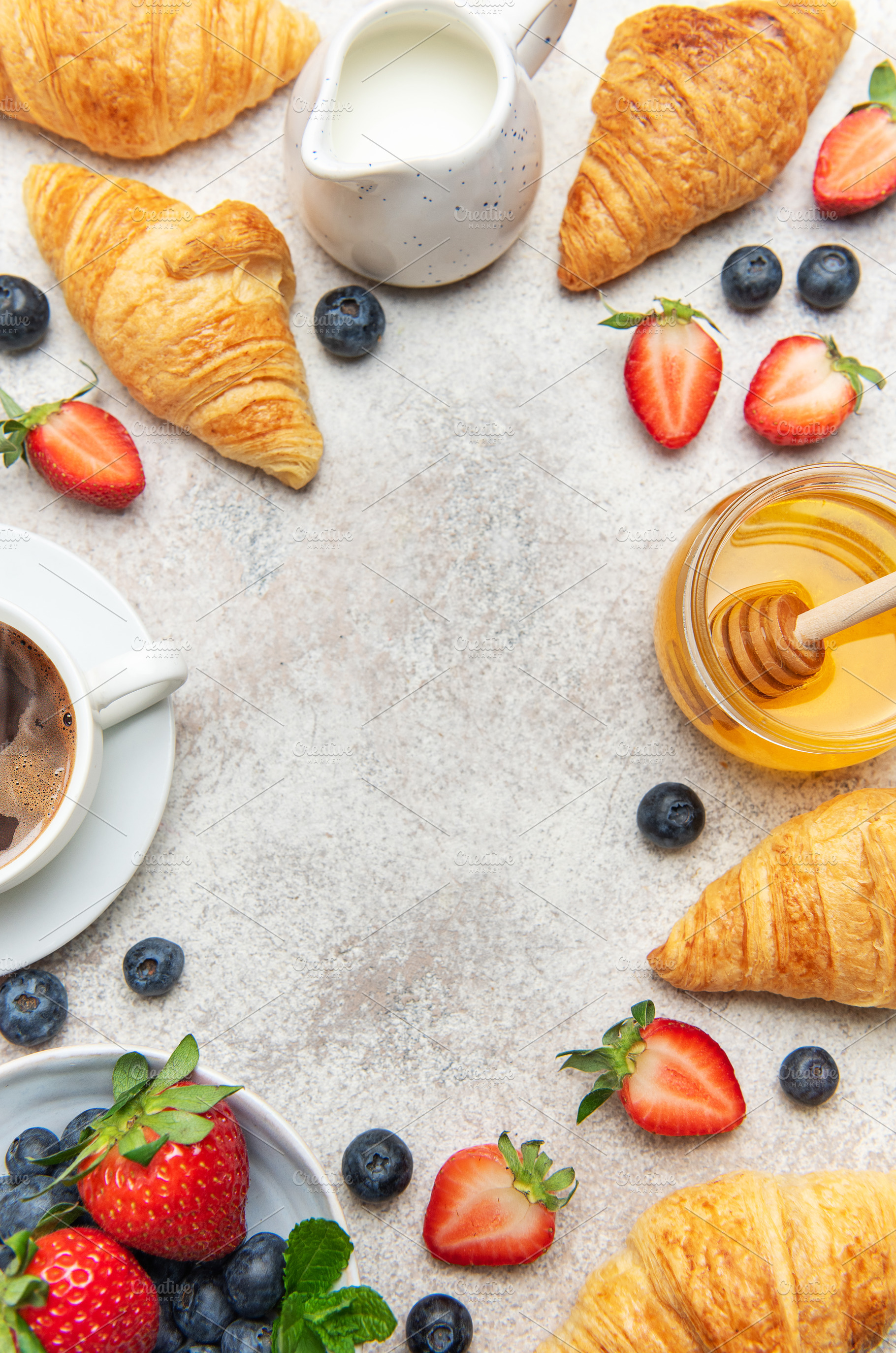 Continental breakfast composition with croissants, coffee, berri, a Food & Drink Photo by Olena Rudo
