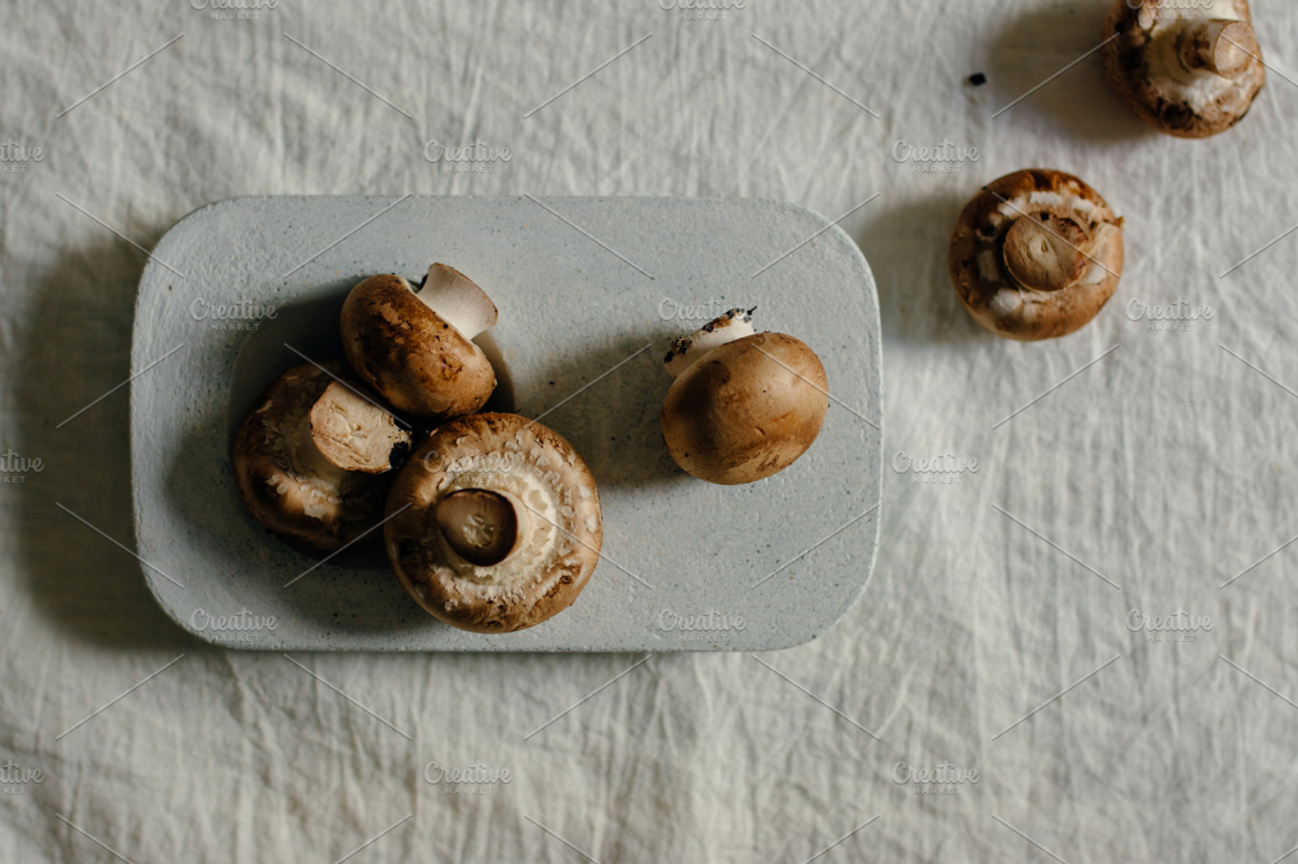 Raw mushrooms in blue stone table stock photo containing mushroom and, a Food & Drink Photo by SZ IMAGE