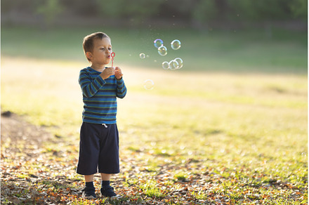 Cute little white boy blowing soap, a Person Photo by Barcelona_dreams