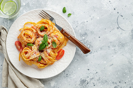 Tasty appetizing classic italian tagliatelle pasta with tomato sauce, cheese pa, a Food & Drink Photo by Budarinphoto