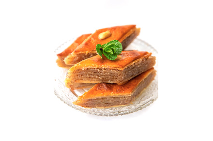 Oriental sweet baklava isolate on a, a Food & Drink Photo by yanadjana