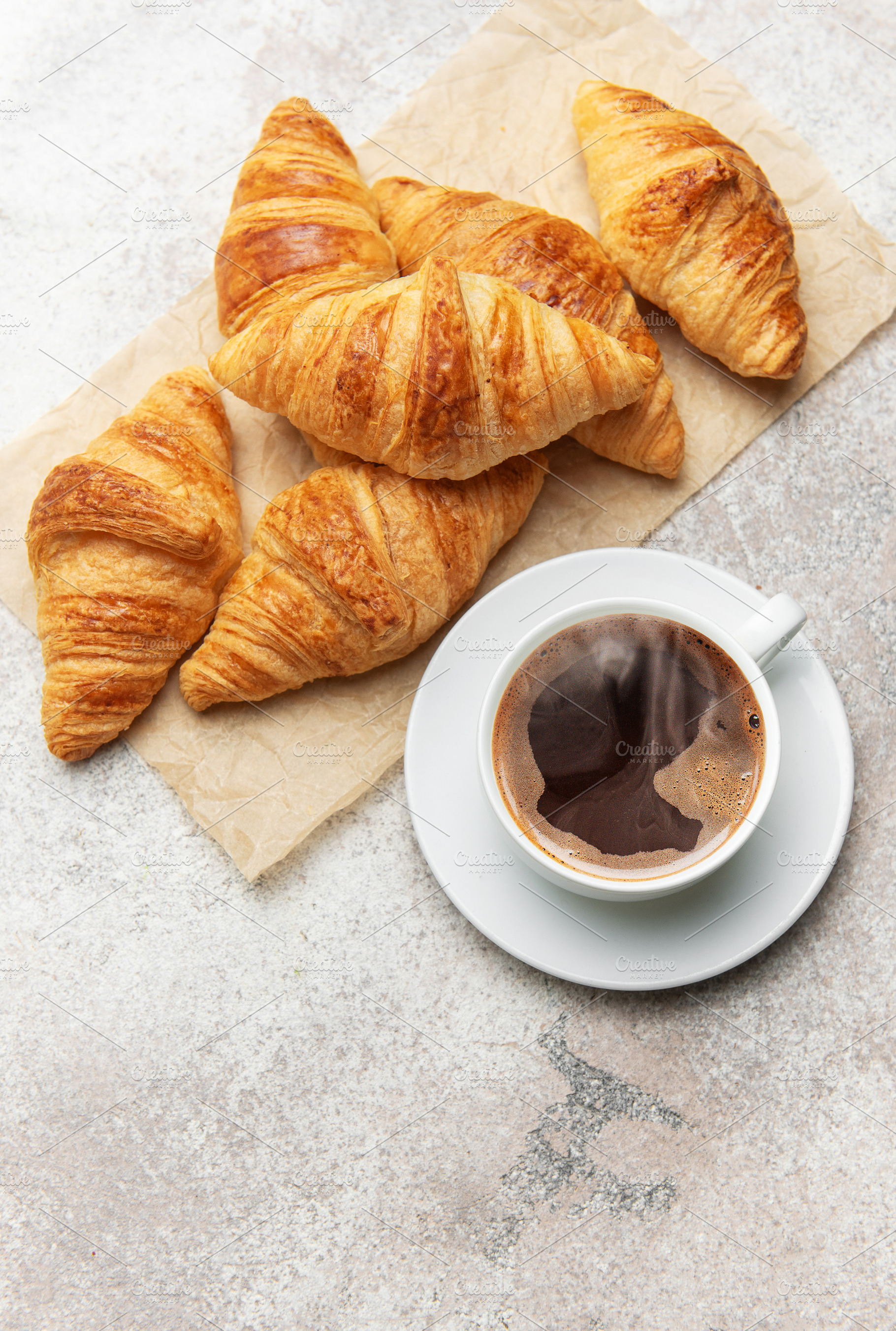 Freshly baked croissants and steaming cup of coffee creating per, a Food & Drink Photo by Olena Rudo
