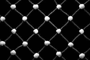 Closeup of black and white knotted rope net pattern with texture, an Abstract Photo by José Manuel Gelpi