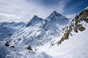 Majestic snow-covered mountains under a blue sky, a Nature Photo by AlyaAnd