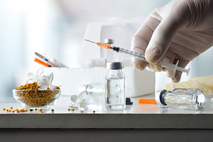 Nurse holding syringe with gloves for pollen vaccination in hosp, a Health & Medical Photo by Davizro's Market