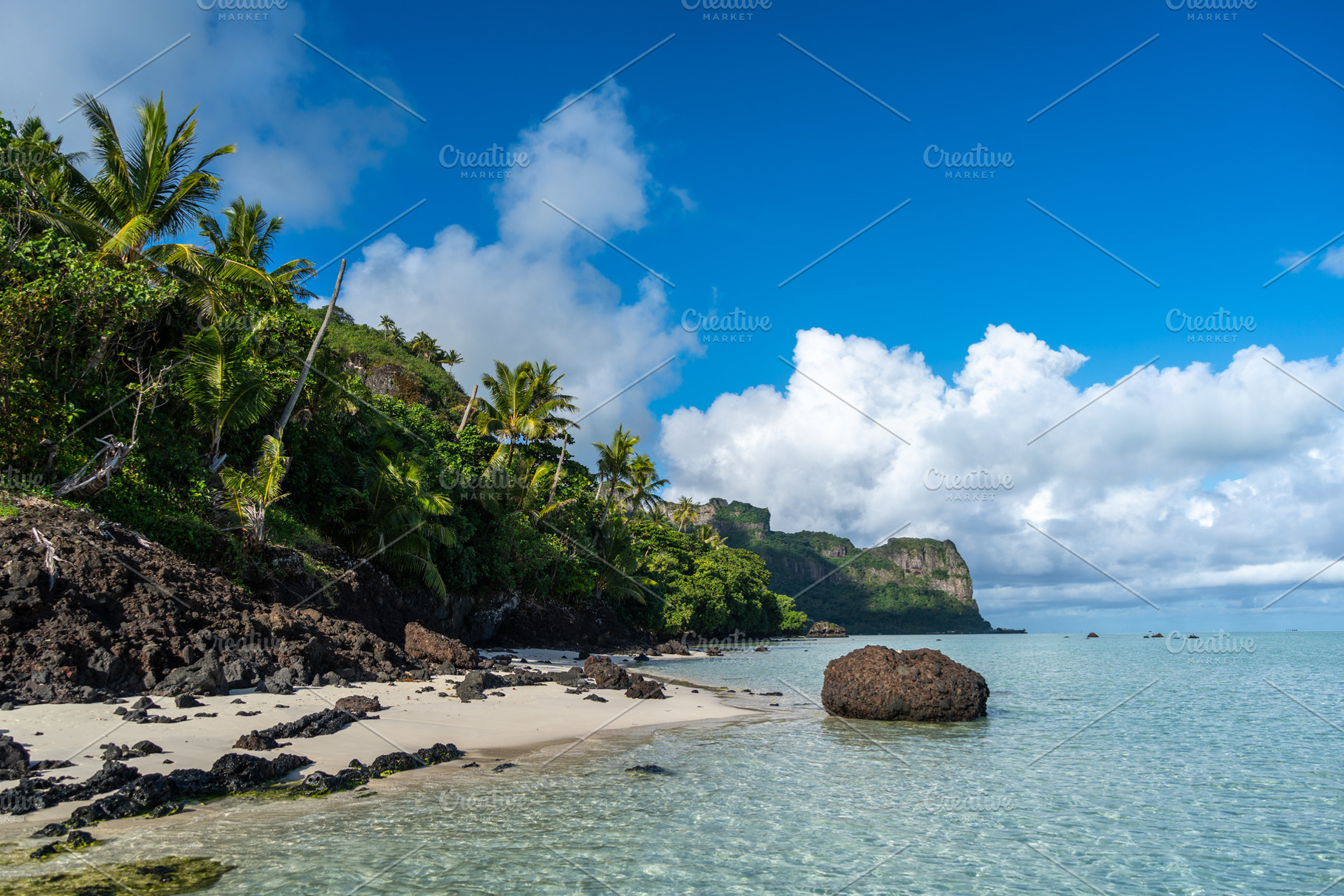 Idyllic white sand beach with coconut trees on Maupiti island, F, a Photo by GoodGoods