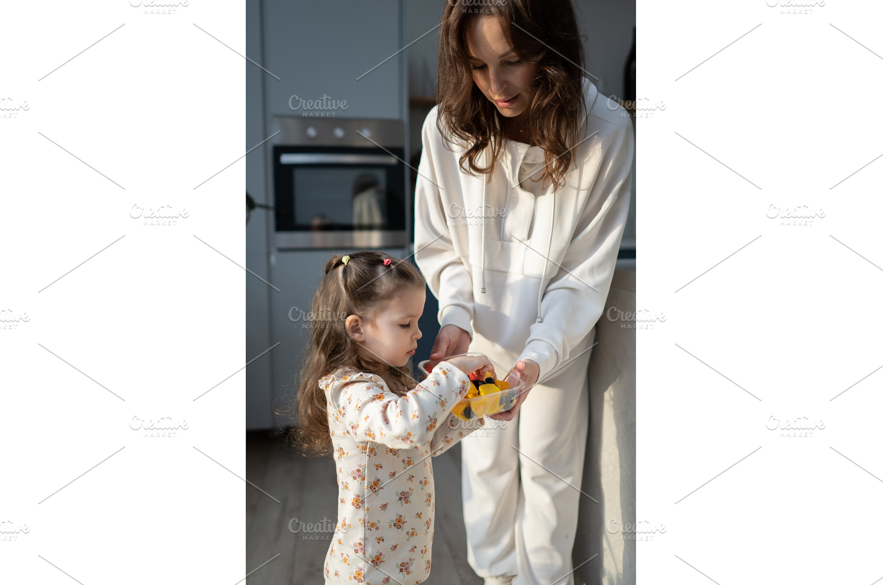 Kitchen interaction as mom gives, a Food & Drink Photo by undrey