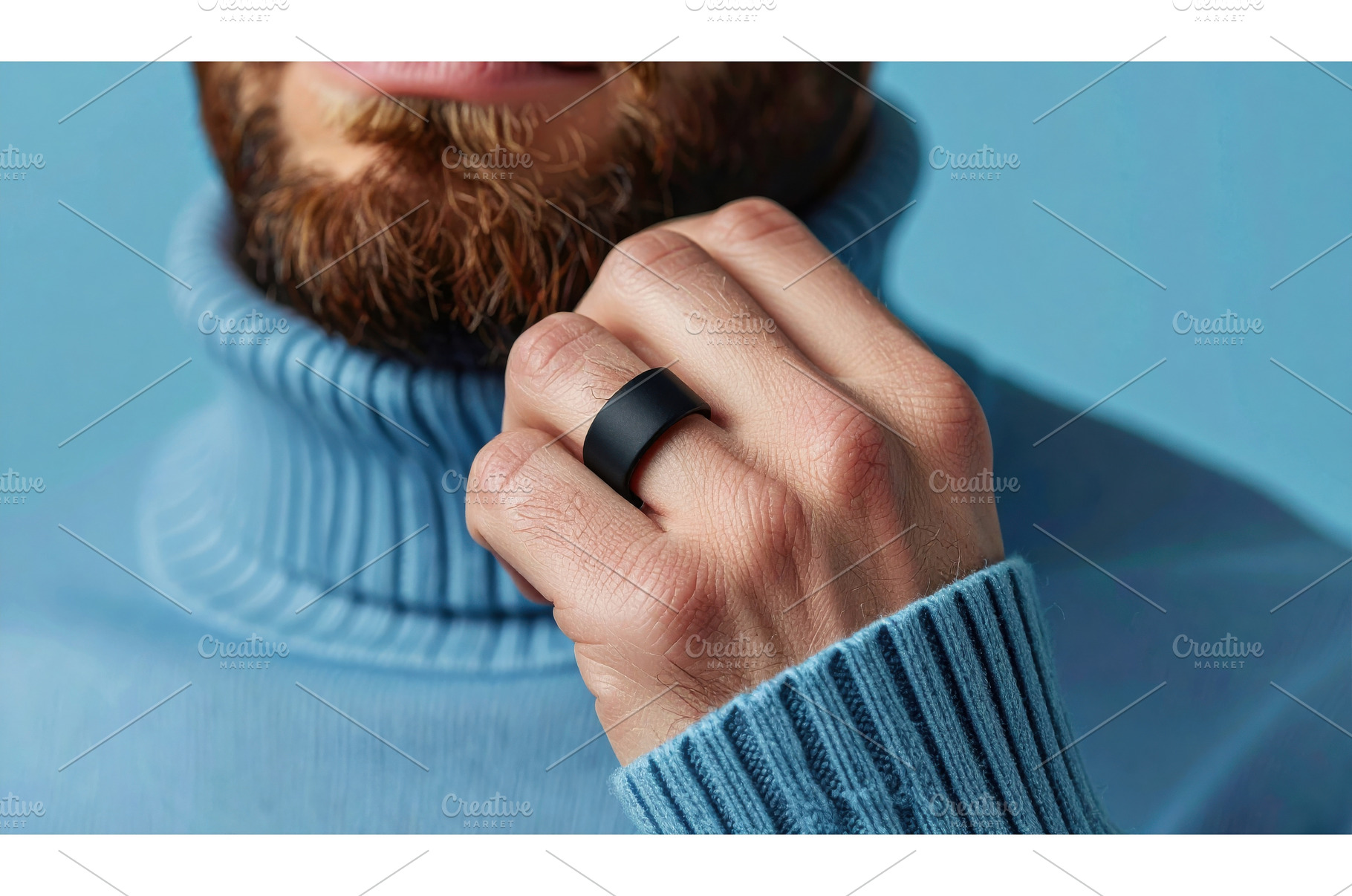 Bearded man wearing black smart ring, a Technology Photo by Igor Tichonow