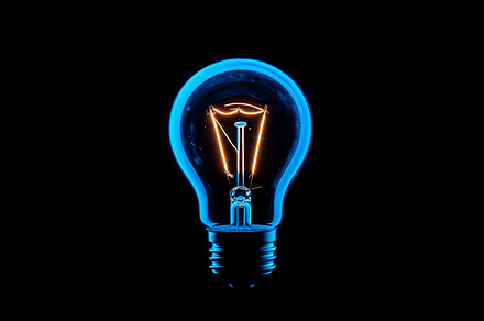 Glowing lightbulb on black, a Technology Photo by MistyDay