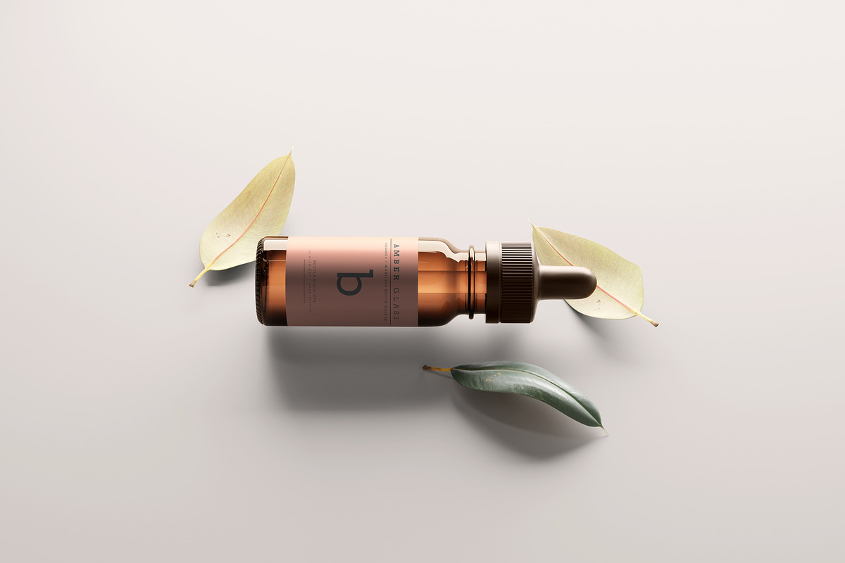 Amber Glass Dropper Bottle Mockups, a Cups & Container Mockup by pmvch (Photo 13 of 20)