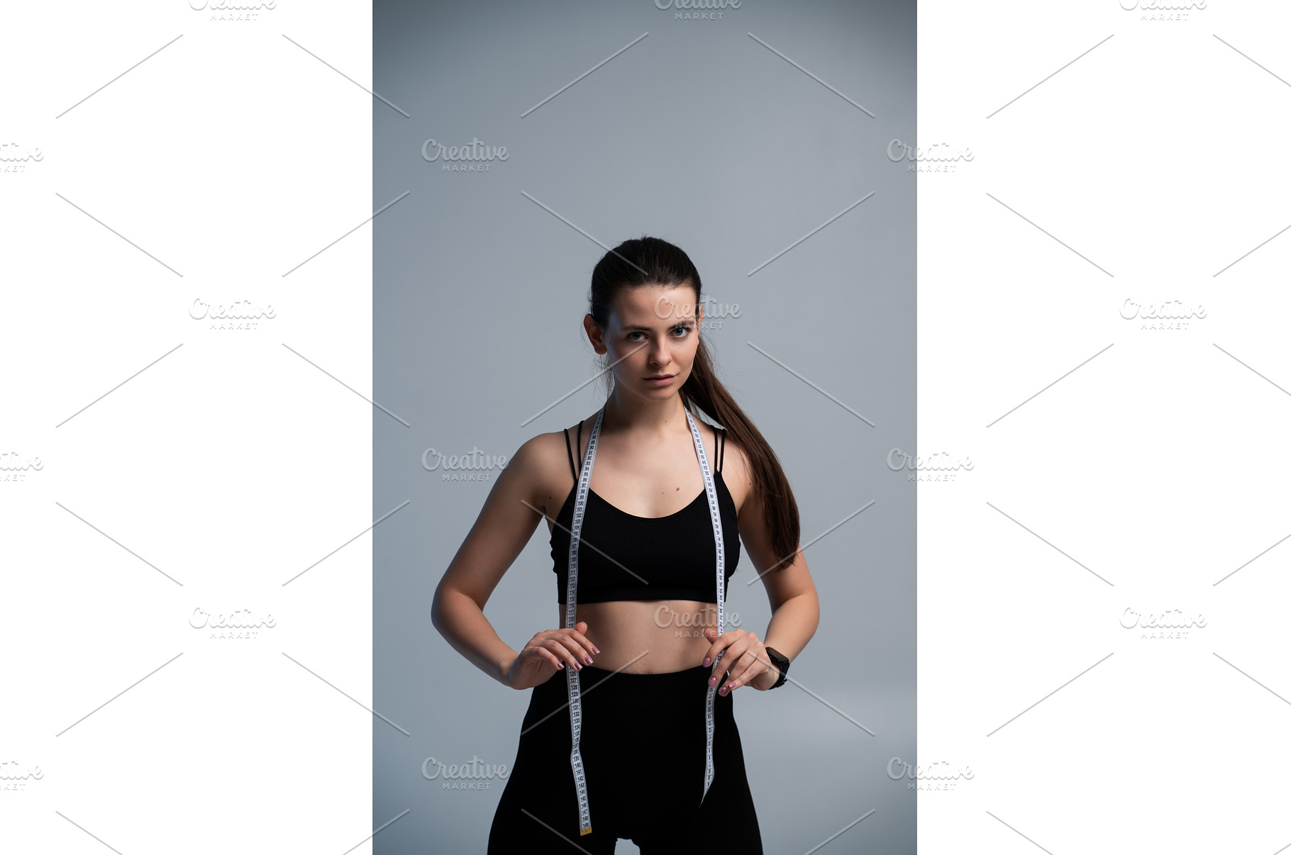 Athletic woman measuring progress, a Sports & Recreation Photo by volodymyrshtun13795