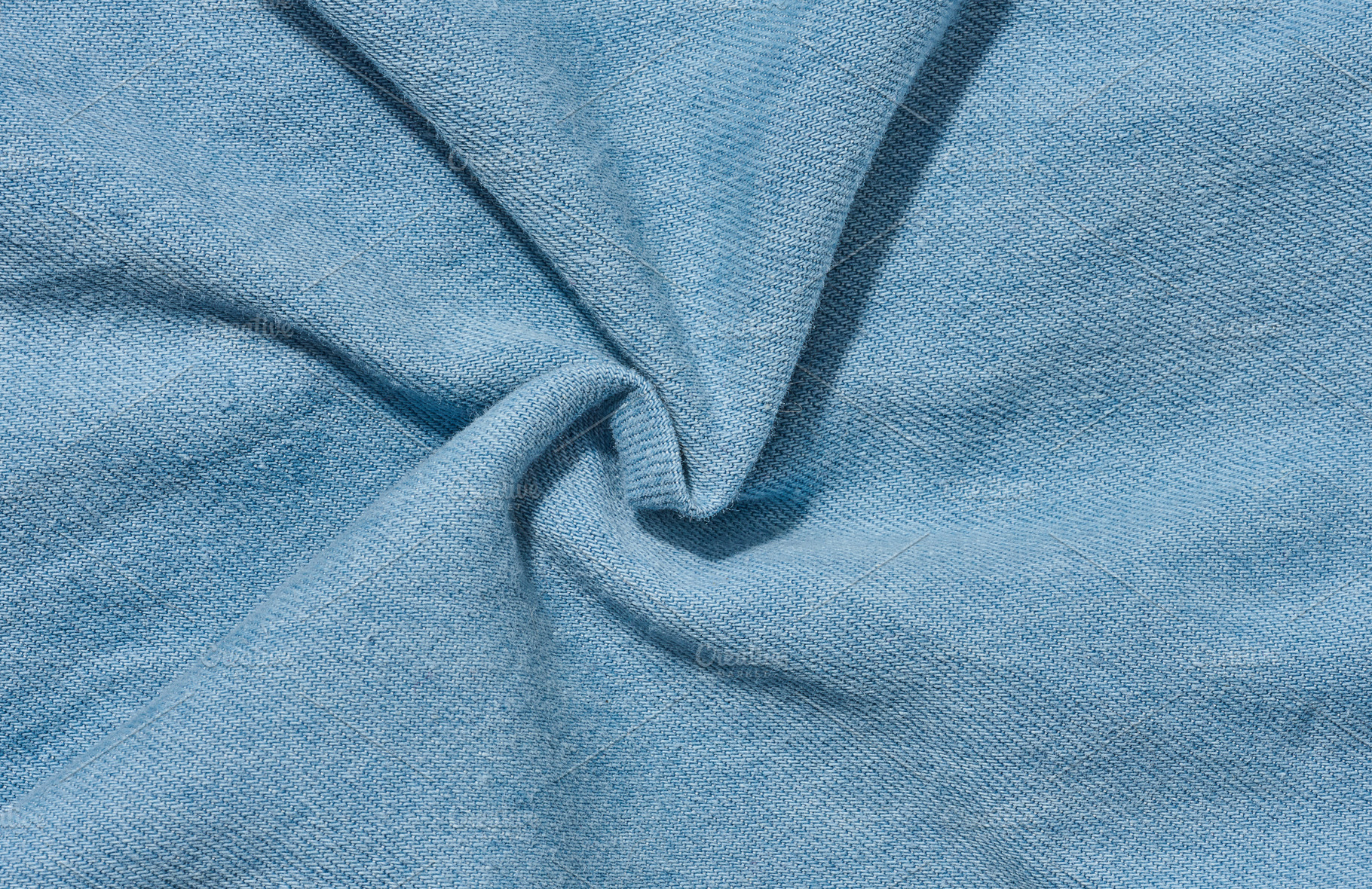 Close-up of the texture of thin light blue denim jeans, an Abstract Photo by ndanko