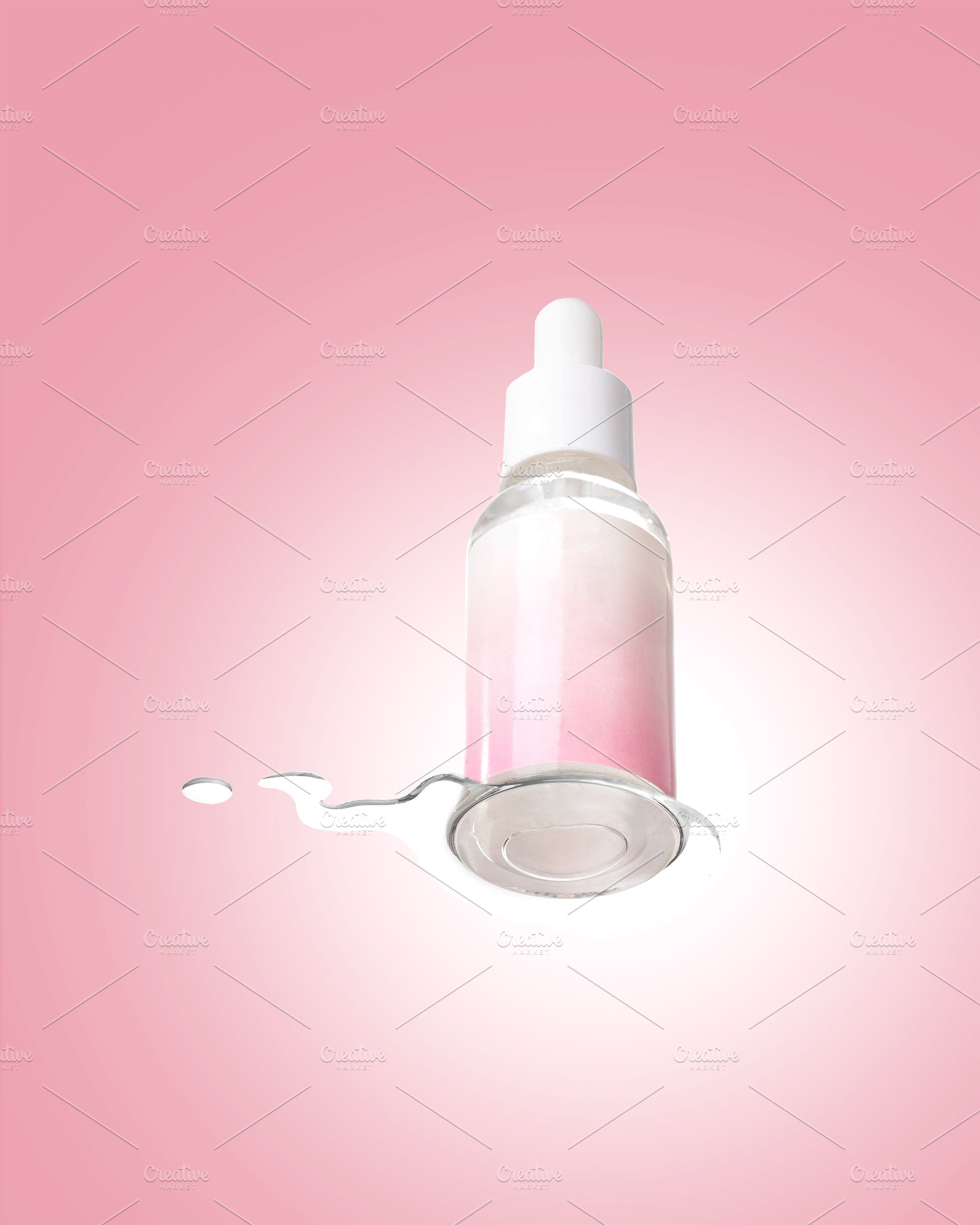 Pink Cosmetic Serum Bottle with Spilled Liquid, a Beauty & Fashion Photo by vimart
