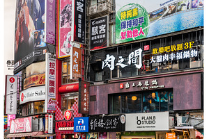 Vibrant shopfront signage crowding a, an Architecture Photo by Leonid Andronov